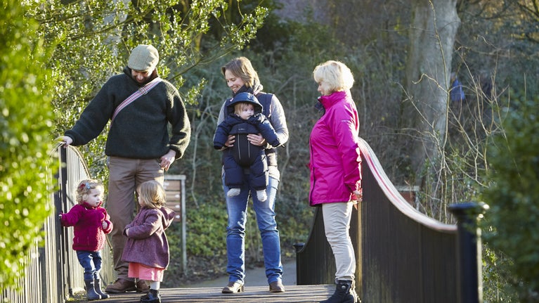 A family visiting Stourhead during the winter